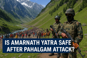 Pilgrims walking the Amarnath Yatra trail in the Himalayas under heavy security presence after the Pahalgam attack, with snow-covered mountains in the background.