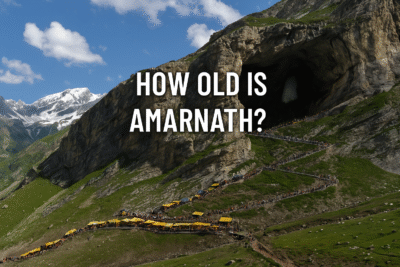 Scenic view of the ancient Amarnath Cave surrounded by snow-capped mountains, symbolizing the timeless spiritual heritage of the Hindu pilgrimage site.