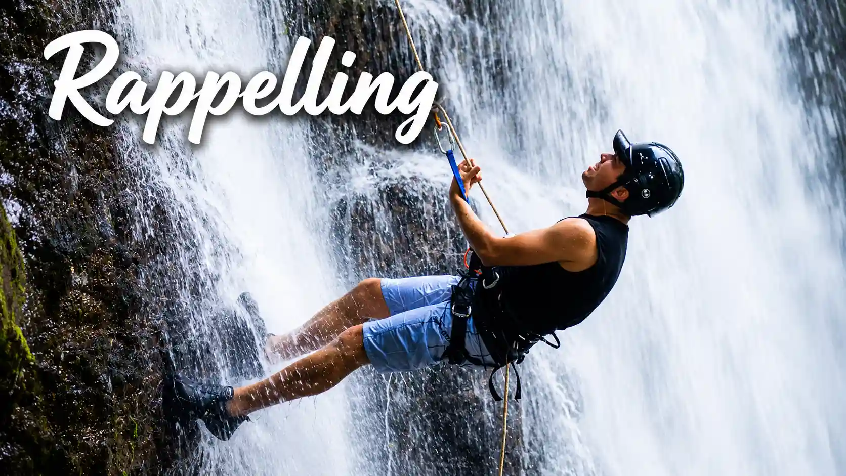 Rappelling beside a majestic waterfall